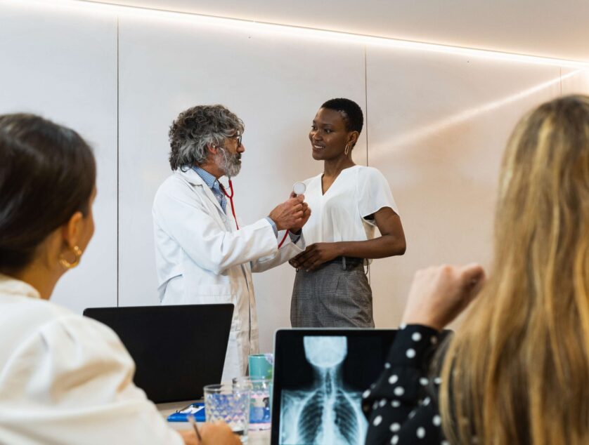 group-of-doctors-examining-patient-in-hospital-2025-04-04-18-41-38-utc